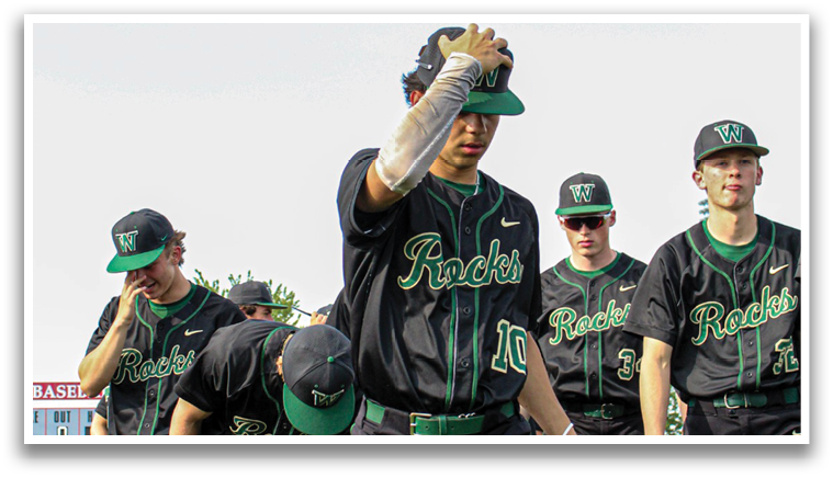 A group of baseball players wearing green and black uniforms are walking on a field. AI generated content