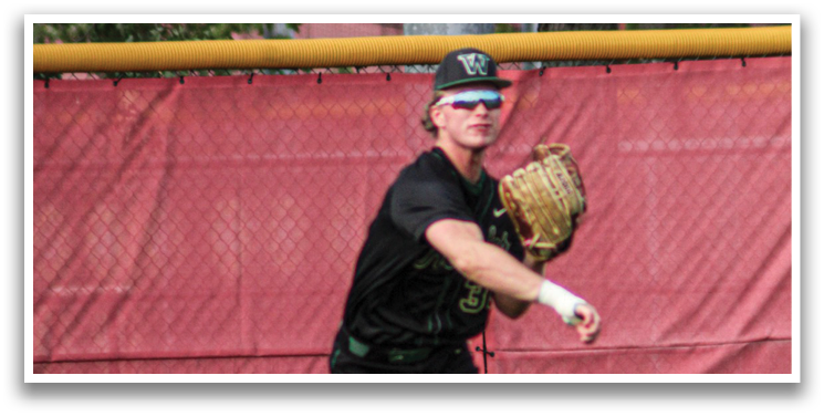A baseball player in a black shirt and white shoes is throwing a ball. AI generated content