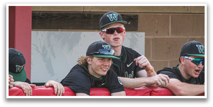 A group of baseball players wearing black and white uniforms sit on a bench. AI generated content