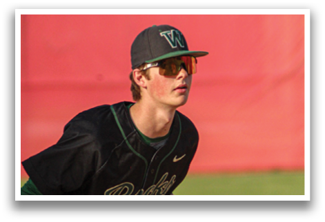 A baseball player wearing a black and green jersey and a red hat, holding a baseball glove. AI generated content