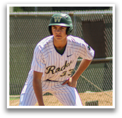 A baseball player in a green helmet and white uniform is crouching on the field, ready to catch a ball. AI generated content