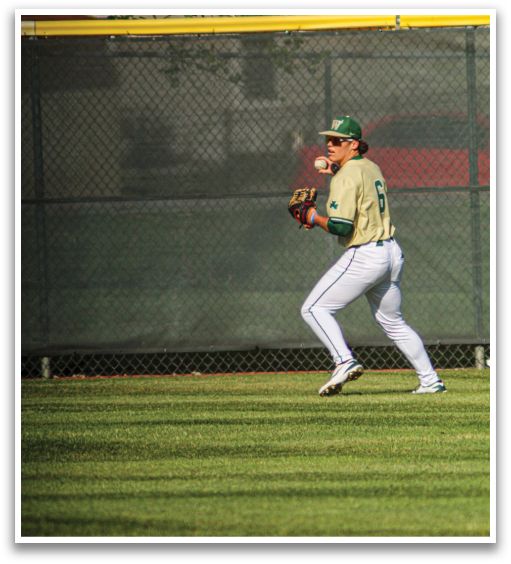 A baseball player wearing a green and white uniform is standing on a field, holding a baseball bat and preparing to swing. AI generated content