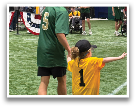 Two young boys are playing baseball on a field. One boy is wearing a blue shirt with the number 2 on it. AI generated content