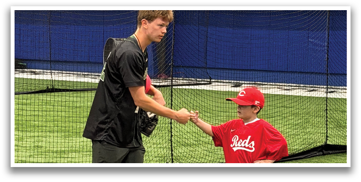 Two men shake hands in a baseball field. AI generated content