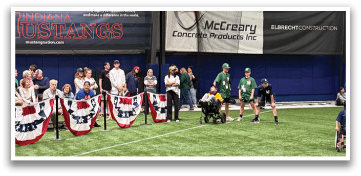 A group of people are standing on a baseball field, some of them holding American flags. AI generated content
