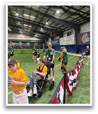 A group of people are standing in a field, some of them wearing baseball uniforms. A boy is holding a baseball bat, and a man is holding a baseball glove. There is also a person holding a baseball bat in the field. AI generated content