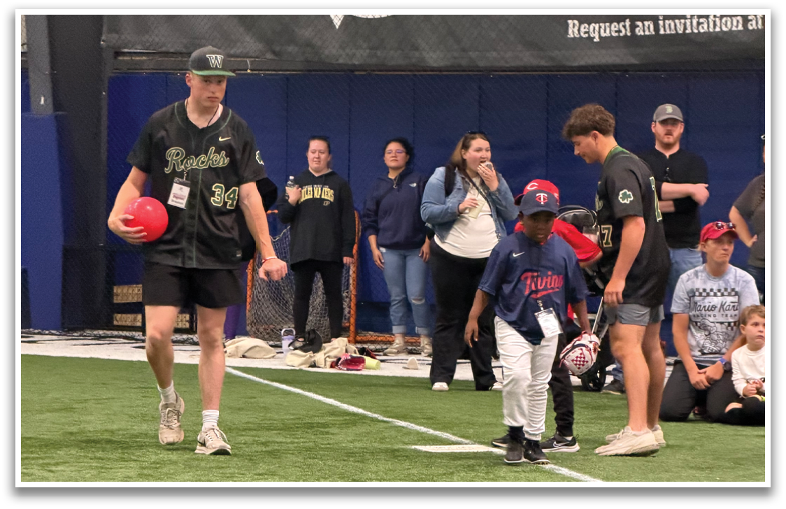 A group of people are standing on a field, with some of them holding sports balls. AI generated content