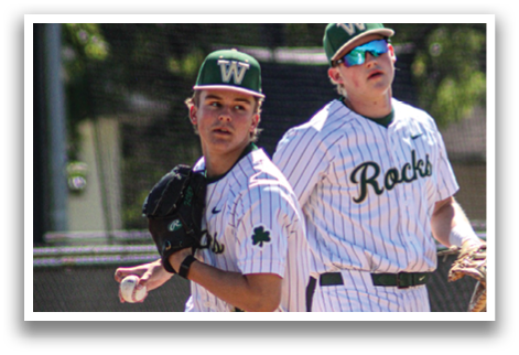 Two baseball players wearing white uniforms and green hats are walking on a field. One player is holding a baseball glove. AI generated content