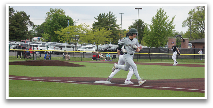 A baseball player running to first base. Description generated by AI