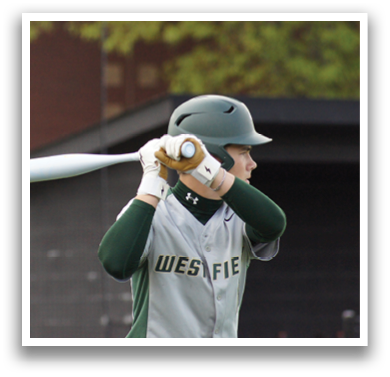 A baseball player is holding a bat and getting ready to swing. Description generated by AI