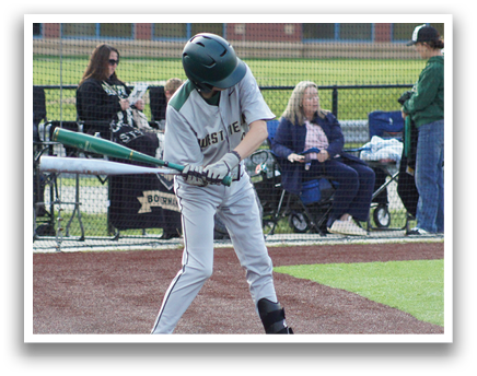 A baseball player is swinging a bat on a field. Description generated by AI