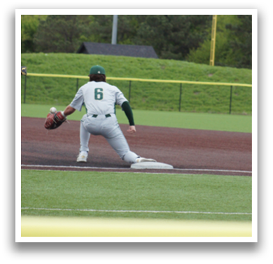 A baseball player wearing a green shirt and white pants is sliding into a base. Description generated by AI
