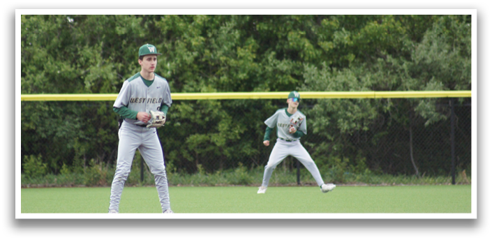 Two baseball players on a field. Description generated by AI