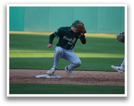 A baseball player slides into a base while another player tries to catch the ball. Description generated by AI