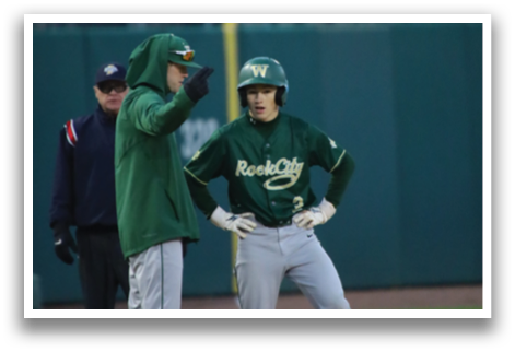 A baseball player wearing a green jersey and a helmet. Description generated by AI