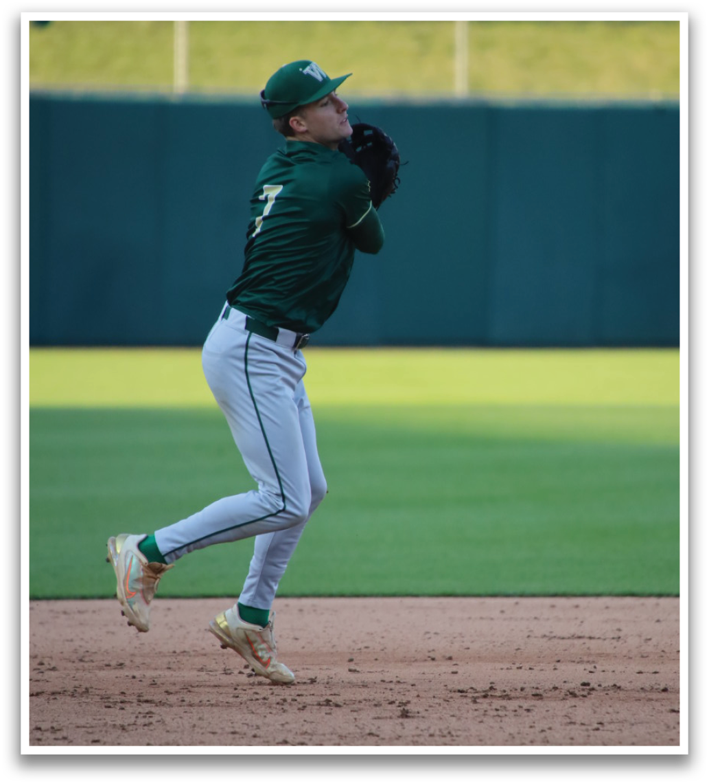 A baseball player in a green and white uniform is pitching a ball. Description generated by AI