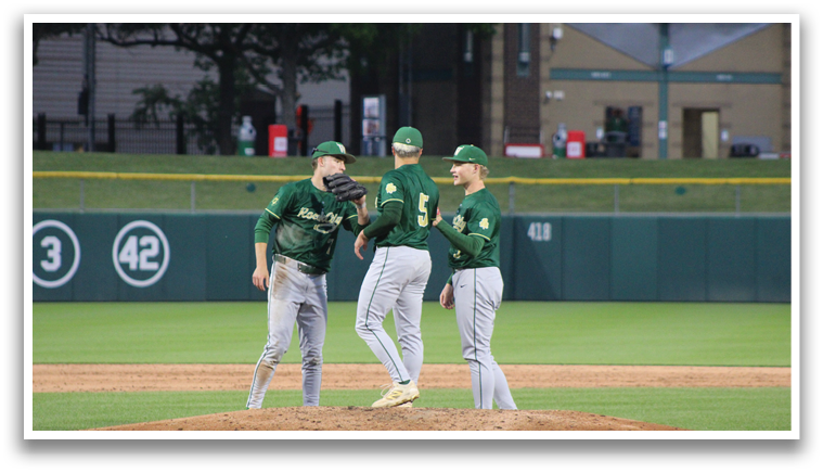 Three baseball players on a field. Description generated by AI