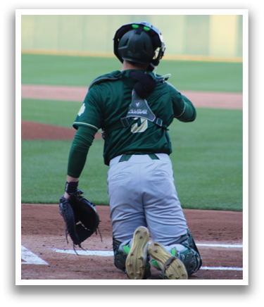 A baseball player is kneeling on the ground with a baseball glove on. Description generated by AI