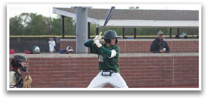 A baseball player in a green and white uniform is swinging a bat. Description generated by AI