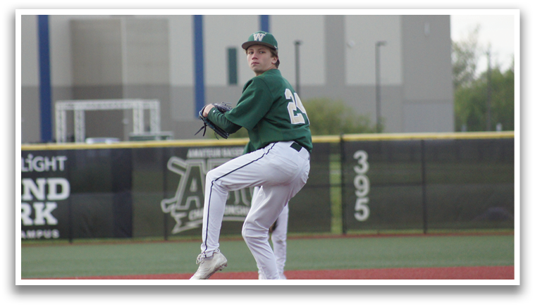 A baseball player in a green shirt and white pants is pitching a ball. Description generated by AI