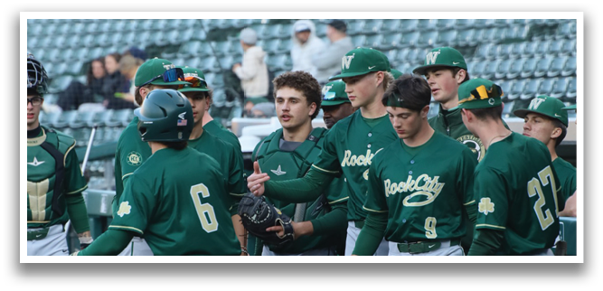 A group of baseball players wearing green and white uniforms. Description generated by AI