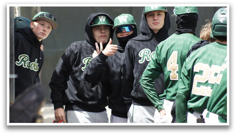 A group of young men wearing green and white uniforms. Description generated by AI