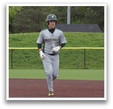 A baseball player in a grey uniform is running on the field. Description generated by AI