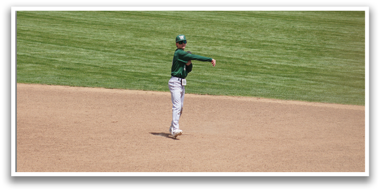 A baseball player in a green and white uniform is throwing a ball. Description generated by AI