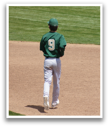 A baseball player wearing a green and white uniform. Description generated by AI