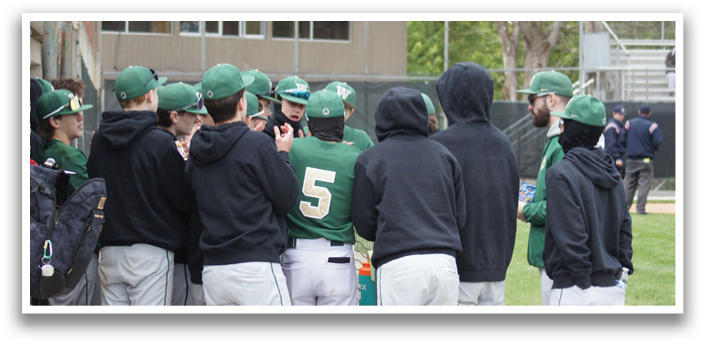 A group of baseball players wearing green and white uniforms. Description generated by AI