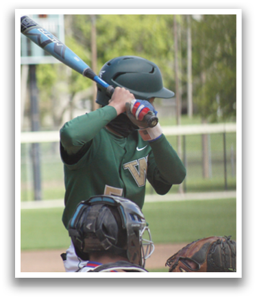 A baseball player is holding a bat and getting ready to swing. Description generated by AI