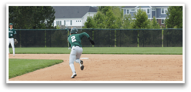 A baseball player running on a field. Description generated by AI