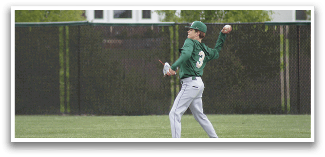 A baseball player wearing a green shirt and white pants is throwing a ball. Description generated by AI