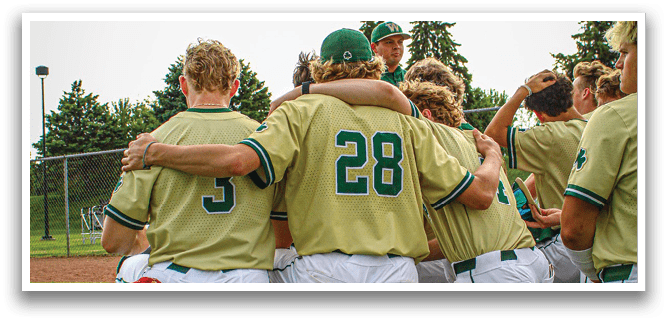 A group of baseball players huddled together on the field. Description generated by AI