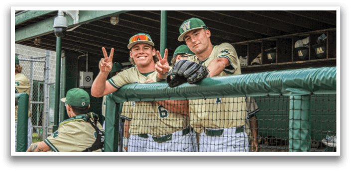 Two baseball players sitting on a bench. Description generated by AI