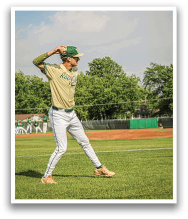 A baseball player is standing on the field. Description generated by AI