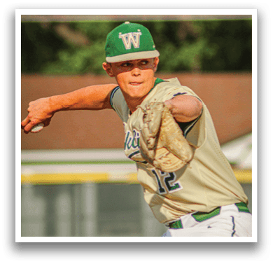 A baseball player wearing a green and white uniform. Description generated by AI