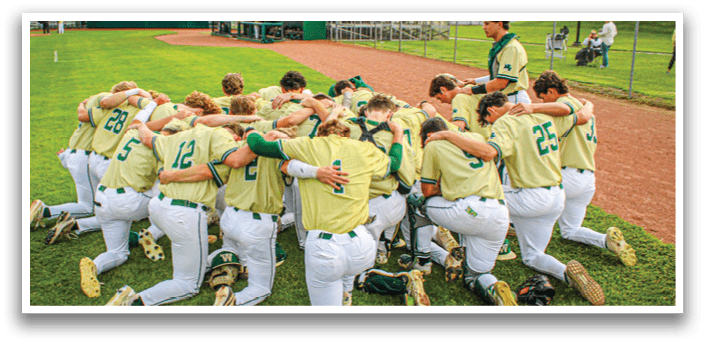 A group of baseball players huddled together on the field. Description generated by AI
