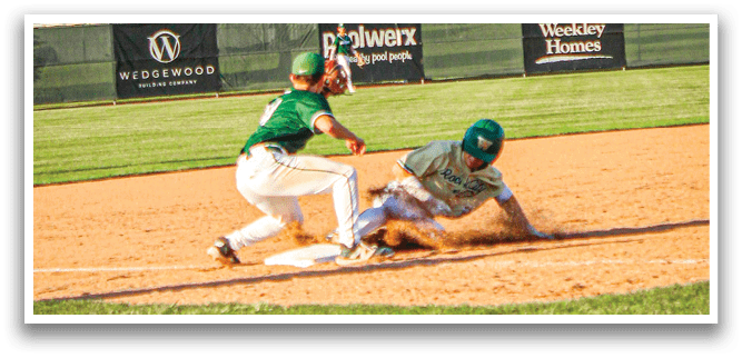 A baseball player slides into a base. Description generated by AI