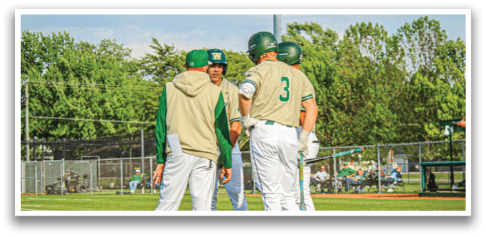 Three baseball players wearing white and green uniforms. Description generated by AI