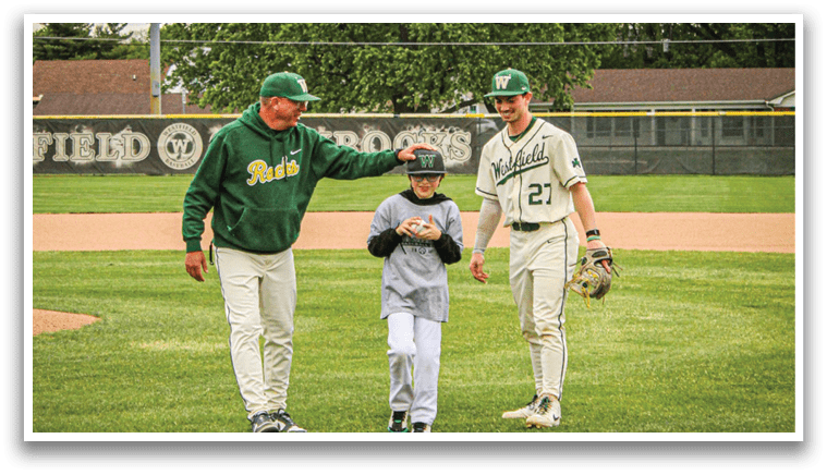Three people on a baseball field. Description generated by AI
