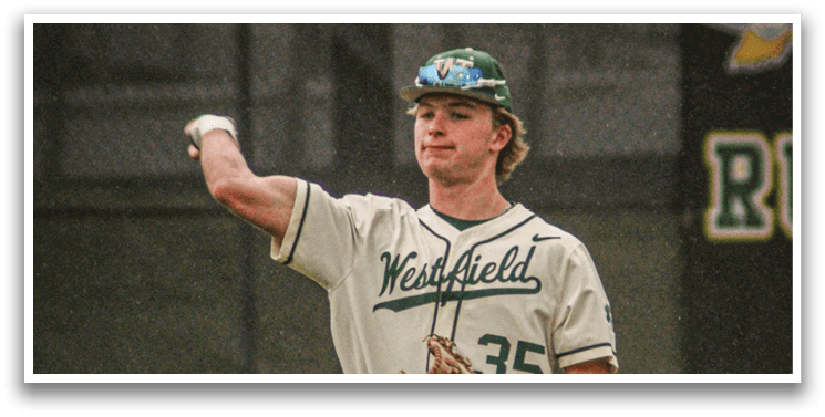 A baseball player wearing a white uniform and a green hat. Description generated by AI