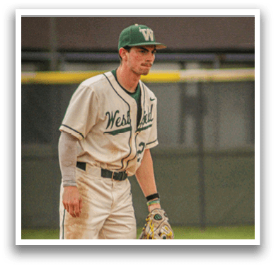 A baseball player wearing a white uniform and a green hat. Description generated by AI