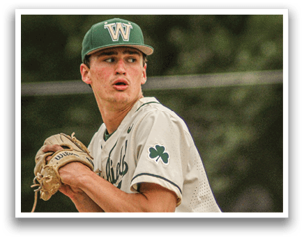 A baseball player wearing a green hat and a white uniform. Description generated by AI