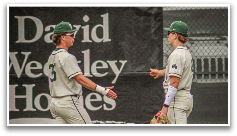 Three baseball players on a field. Description generated by AI