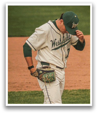 A baseball player wearing a green and white uniform. Description generated by AI