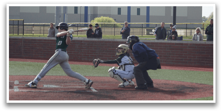 A baseball player is swinging a bat at a ball. Description generated by AI