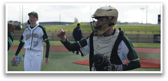 A baseball player wearing a catcher's mitt. Description generated by AI