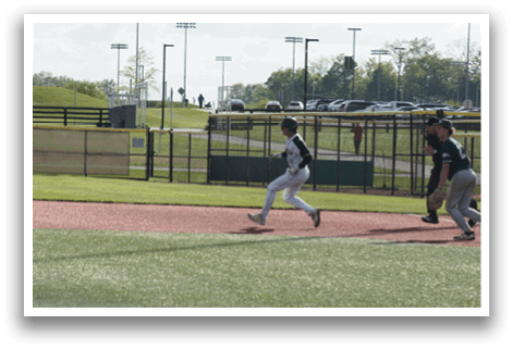 A baseball player running on the field. Description generated by AI