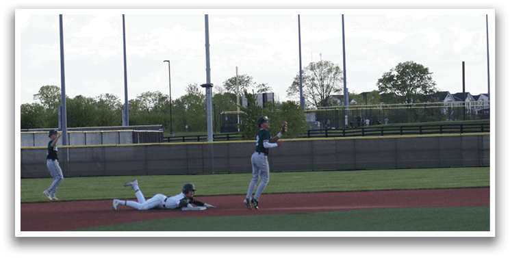 A baseball player slides into home base. Description generated by AI